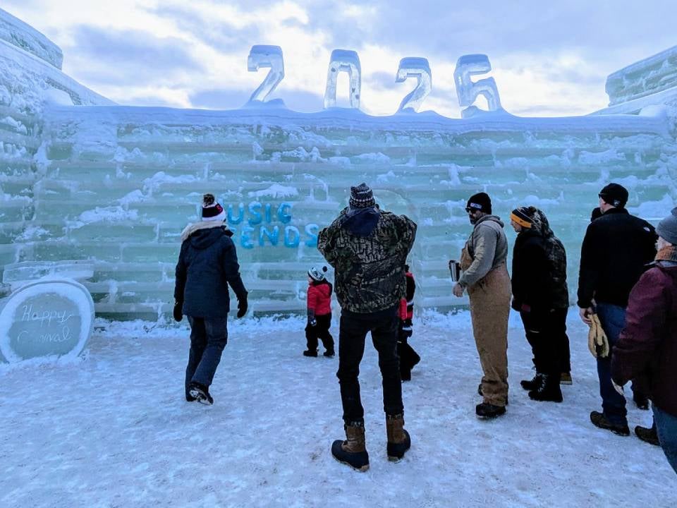 people in front of 2025 ice palace